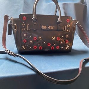 Black floral Coach purse with beautiful detailing